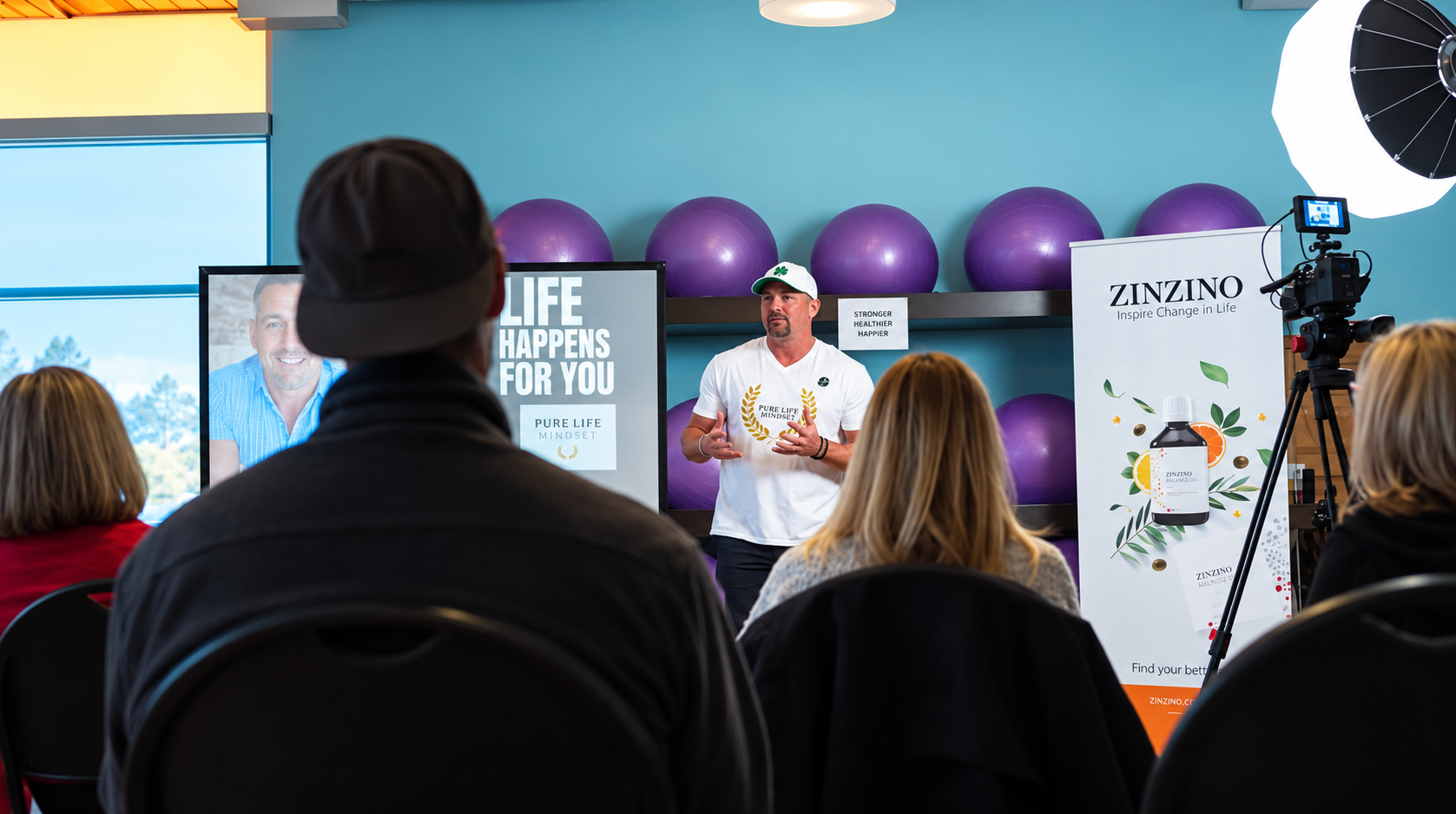 Coach Rob speaking to a live audience at a Pure Life Mindset coaching session